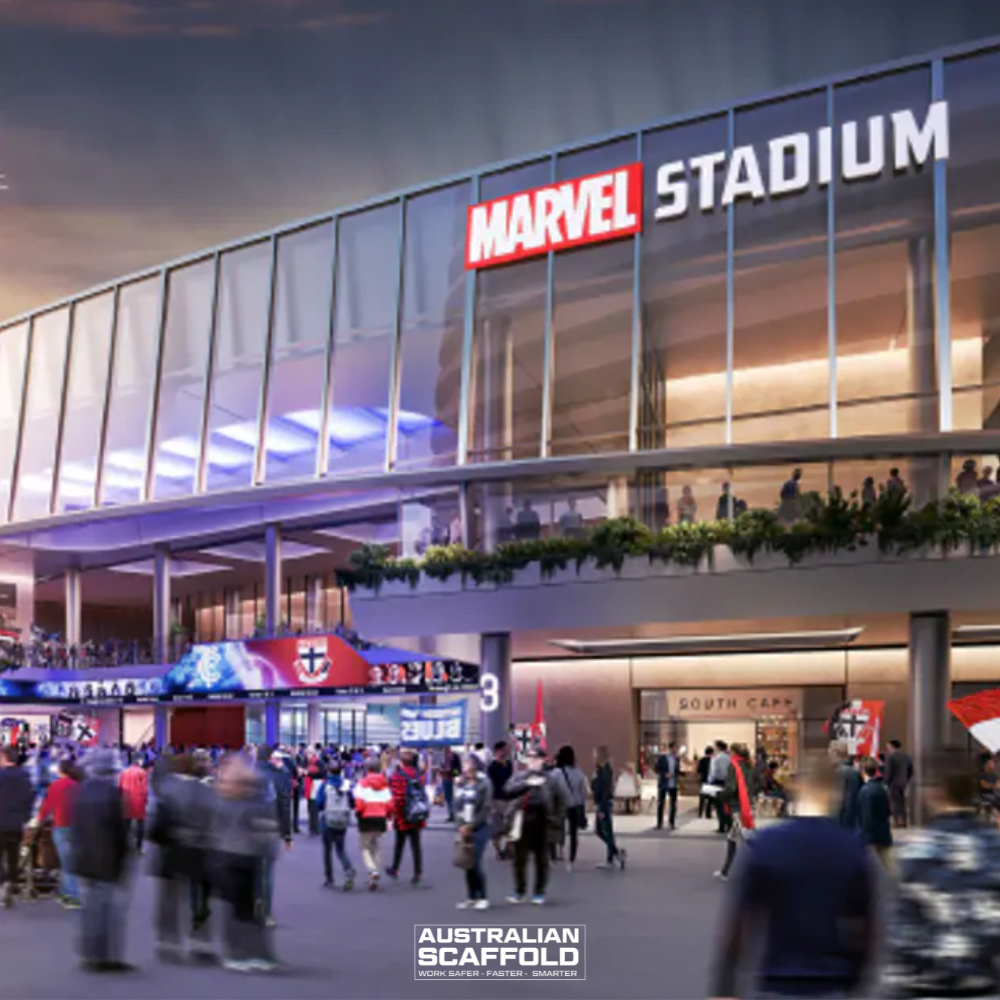Evening view of Marvel Stadium with illuminated signage and crowds gathering